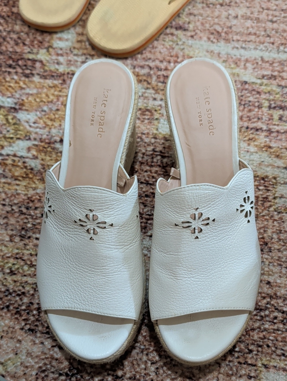 kate spade cream leather open-toe wedge mules with laser-cut motif